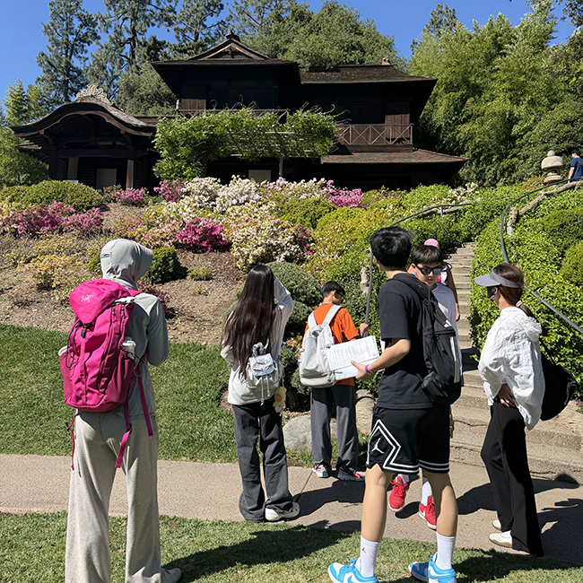 students observing a japanese pagoda