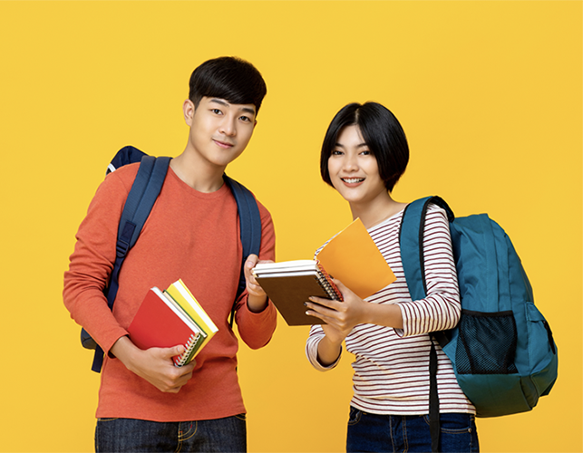 Students smiling over a yellow background