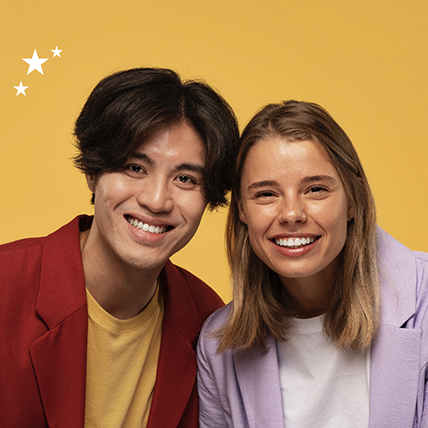 Two students smiling